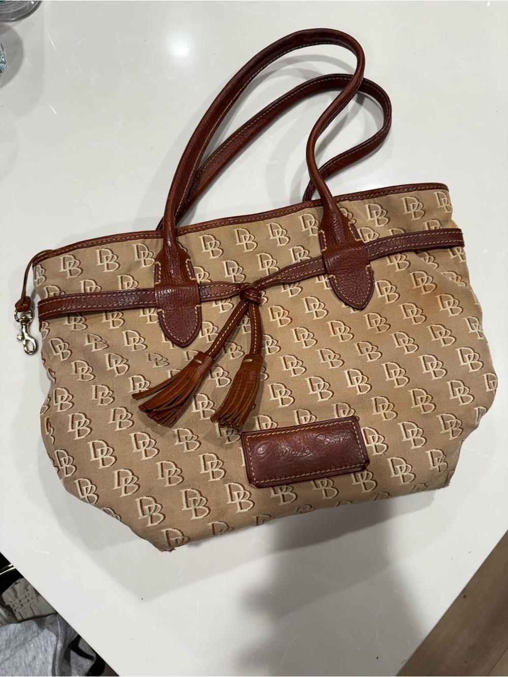 Dooney & Bourke Beige and Brown Mini Tote with Tassel